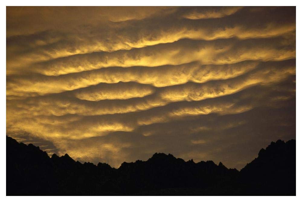 Cumulonimbus clouds at dawn above Norwest Arch, Ben Ohau Range, Southern Alps, New Zealand-Paper Art-50x34”