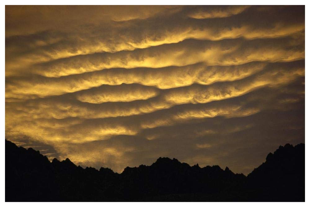 Cumulonimbus clouds at dawn above Norwest Arch, Ben Ohau Range, Southern Alps, New Zealand-Paper Art-62x42”