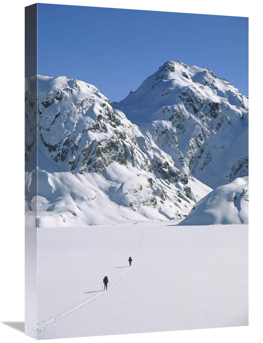 Skiers cross frozen Lake Harris, Routeburn Track, Mt Aspiring NP, New Zealand-Canvas Art-16x24”