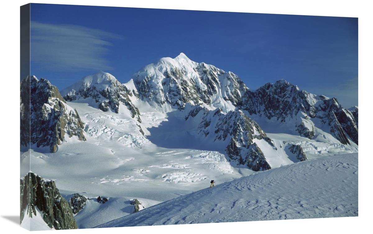 Ski mountaineer near summit with Mt Tasman behind, Westland NP, New Zealand-Canvas Art-30x20”