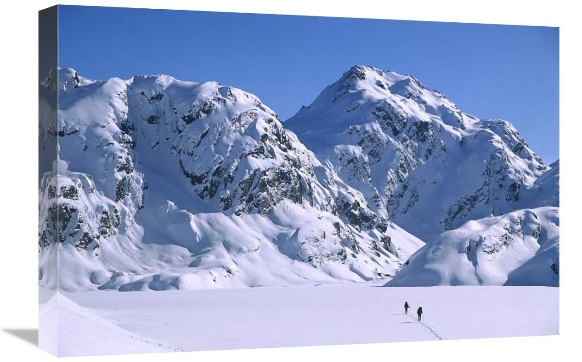 Skiers cross frozen Lake Harris, Routeburn Track, Mt Aspiring NP, New Zealand-Canvas Art-24x16”