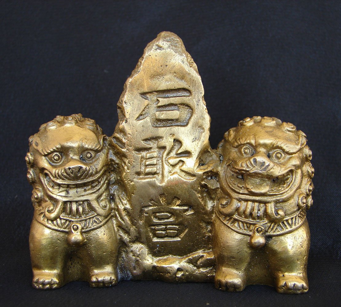 Brass Fu Dogs Sitting Beside Mountain
