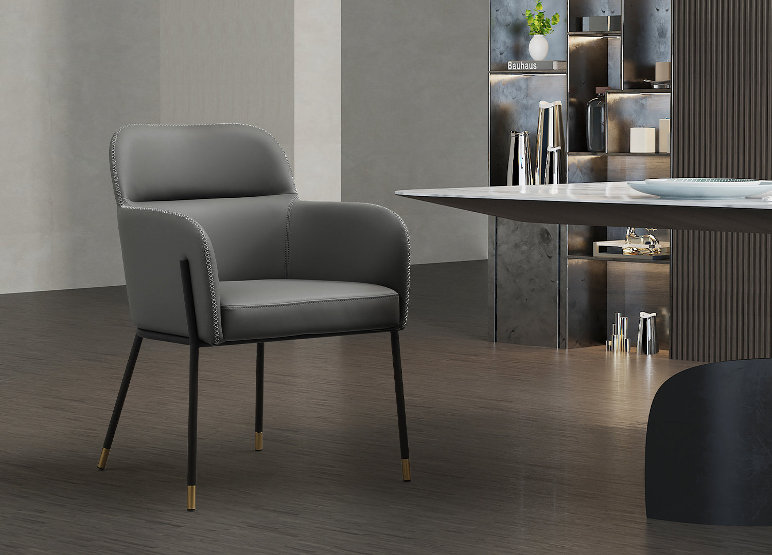 Heidi Dining Armchair, Dark Grey Faux Leather with Light Grey stitch. Sanded Black Coated Steel Legs and 5cm Brushed Brass Leg Caps