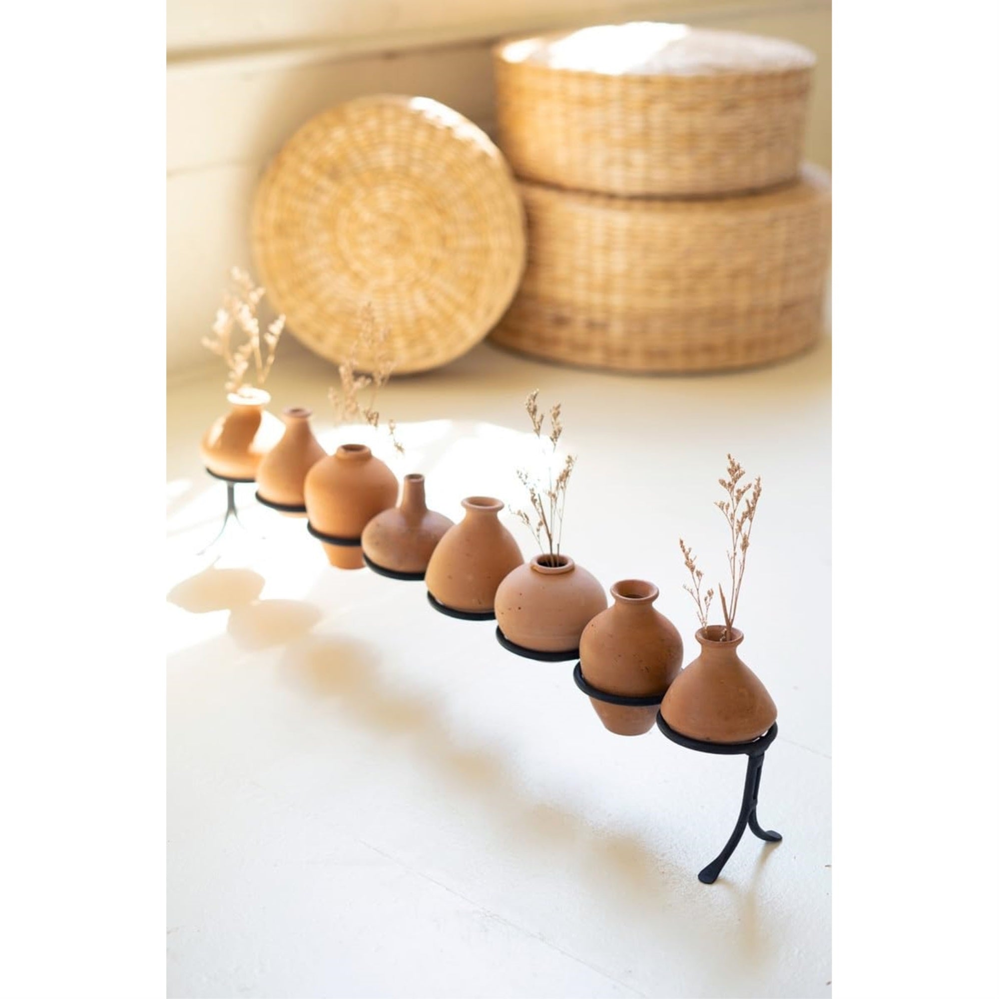 Eight Clay Vessels On An Iron Base