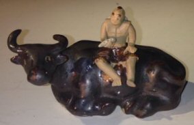 Ceramic Figure Man Sitting On Sitting Buffalo Size Large